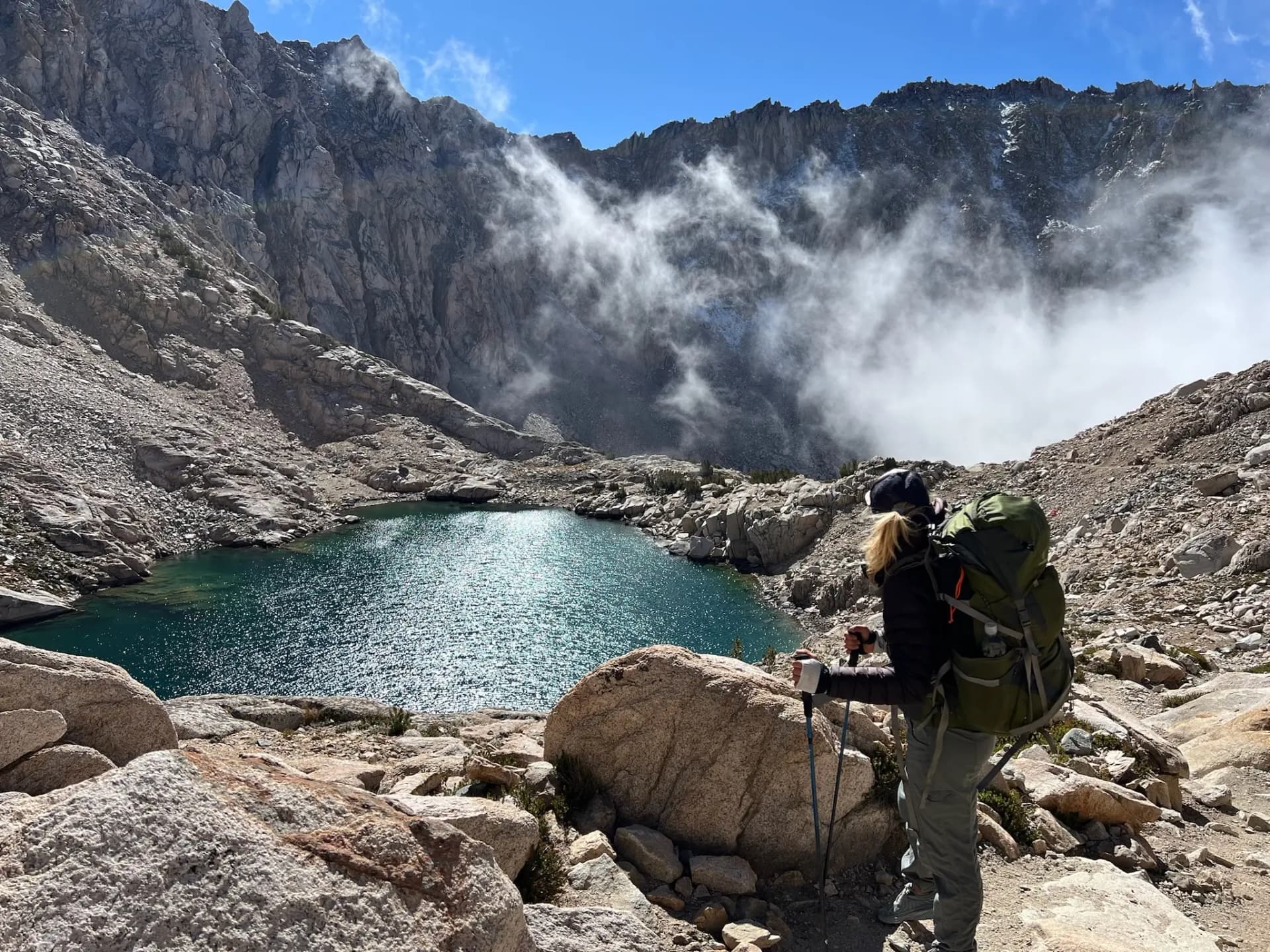 Cara looking South at the clouds rising near Glen Pass.