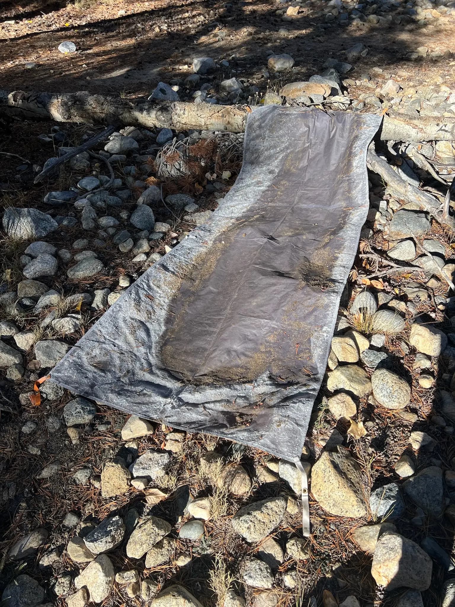 My ground tarp was like an ice chip. Frozen solid. Trying to dry it in the sun.